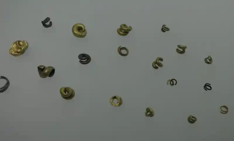 Metallic swirls that look like horns, most are made of gold.